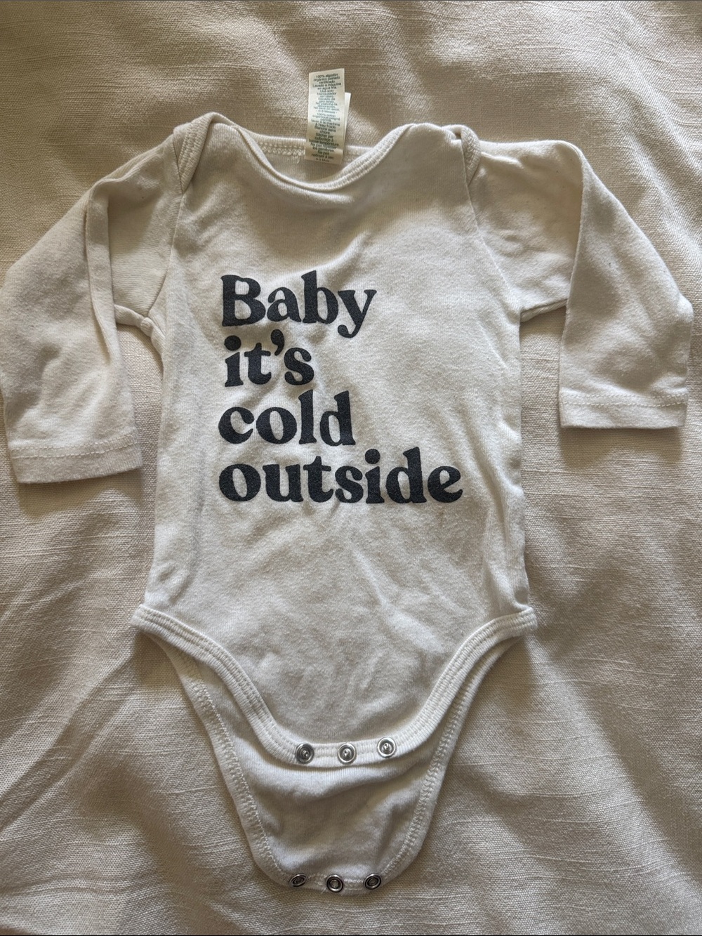 Long-Sleeve beige Baby One-Piece with black Text - 'Baby it's cold outside'